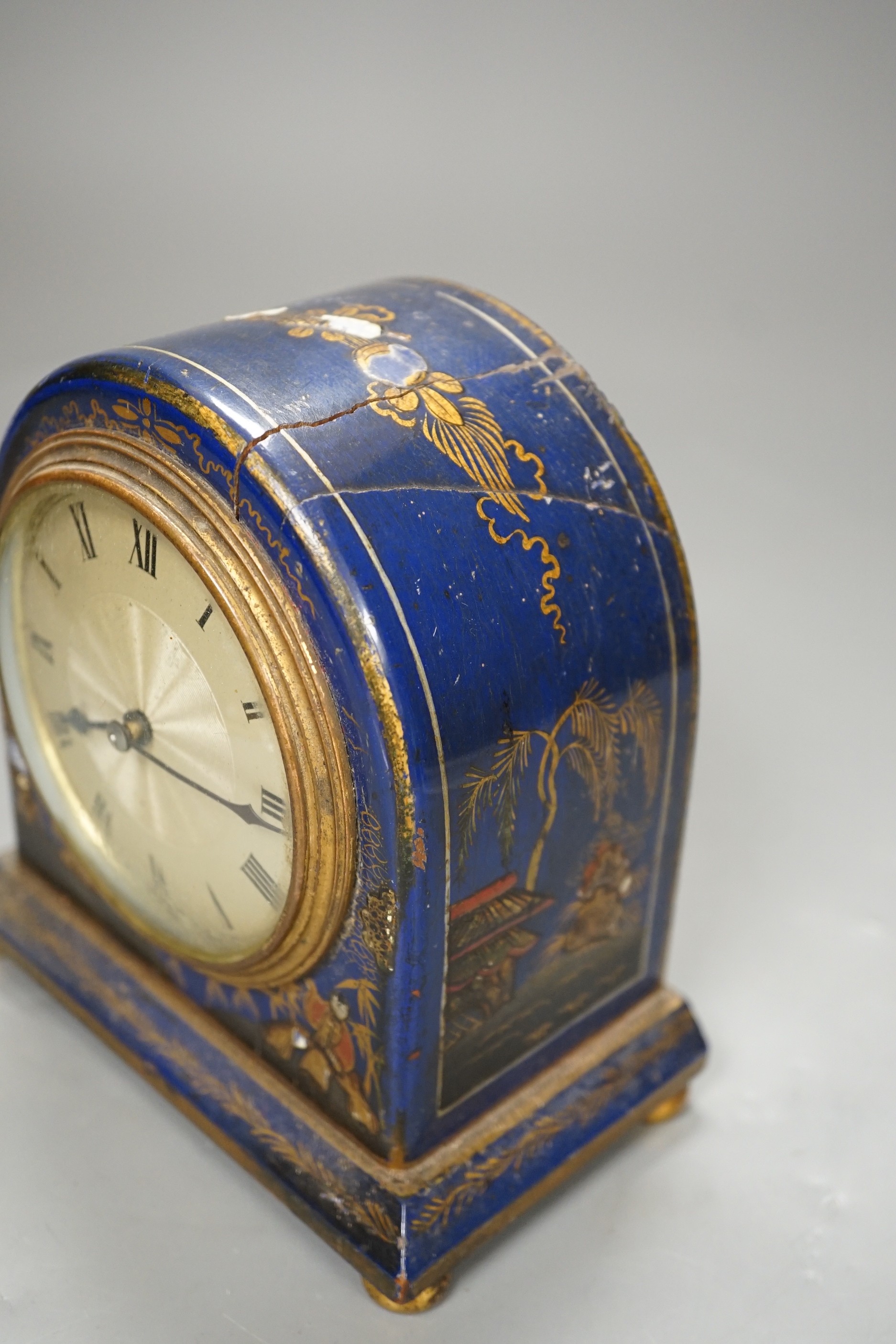 A small Chinoiserie lacquer cased mantle timepiece, (with damage) 14cm tall